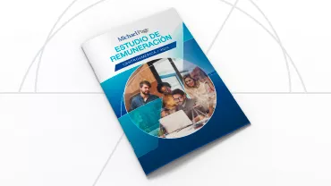 Portada de revista con grupo de personas trabajando en una oficina.